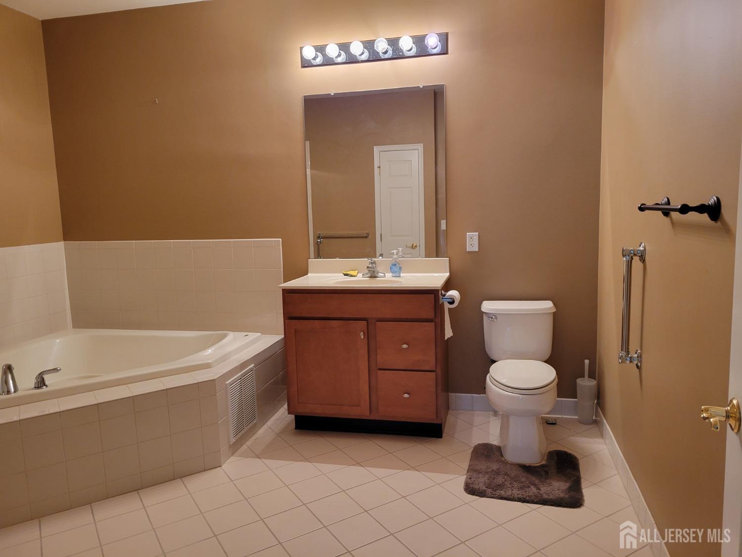 100 Middlesex Boulevard, Unit 341 Plainsboro, NJ 08536 - Photo 14 of 16 a bathroom with a sink a toilet and bathtub