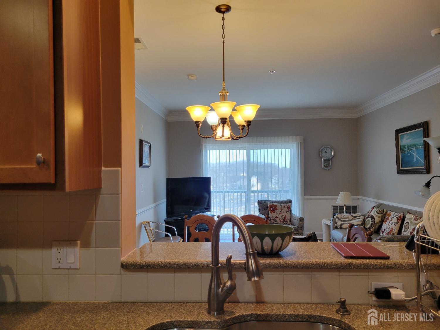 100 Middlesex Boulevard, Unit 341 Plainsboro, NJ 08536 - Photo 5 of 16 a view of a livingroom with furniture and window