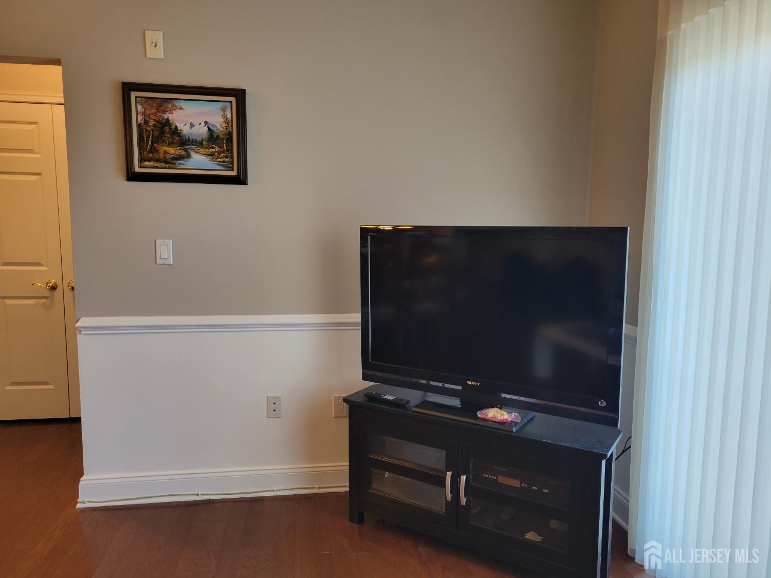 100 Middlesex Boulevard, Unit 341 Plainsboro, NJ 08536 - Photo 7 of 16 a room with furniture and a flat screen tv