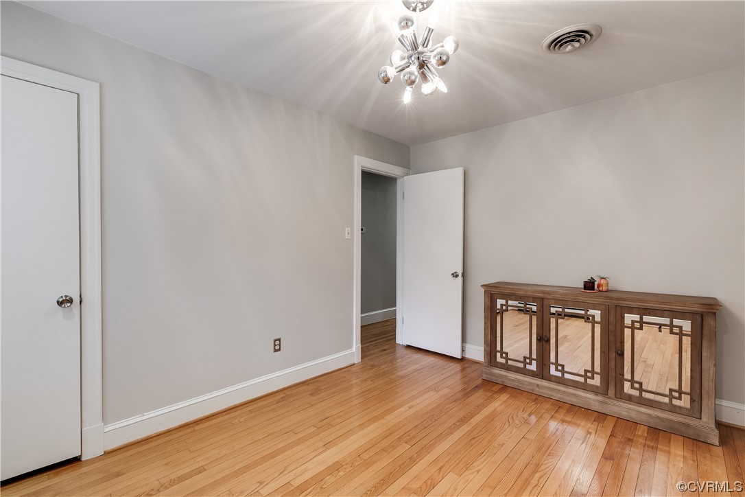 2220 Winterfield Road Midlothian, VA 23113 - Photo 33 of 50 wooden floor in an empty room with a window