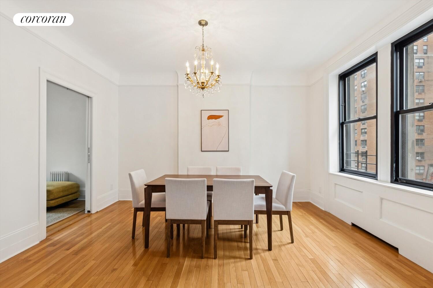 61 East 86th Street, Unit 76 Manhattan, NY 10028 - Photo 3 of 17 a view of a dining room with furniture window and wooden floor