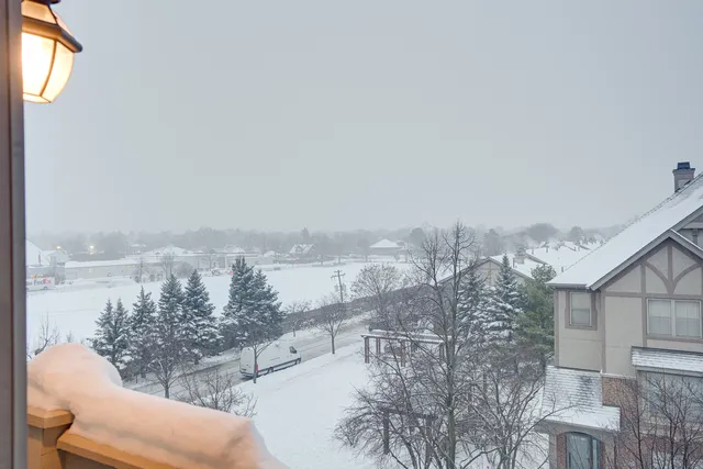 a kitchen with granite countertop a refrigerator stove and sink
