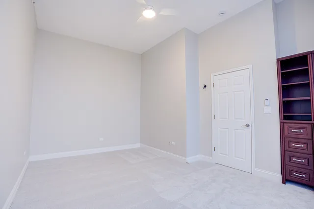 a view of an empty room with closet