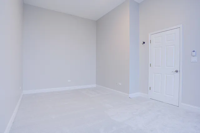a front view of a house with a glass door