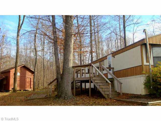 588 Estes Road Reidsville, NC 27320 - Photo 2 of 9 Other. 14X60 2 bedroom, 2 bath single wide(not on permanant foundation) with a built on front wooden dual staircase deck. 16X16 Storage building with attached shed area