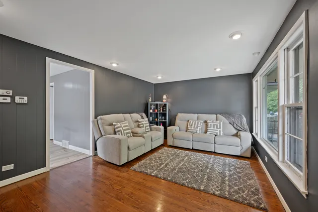 a living room with furniture and a rug
