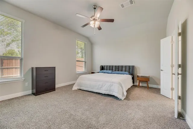 a bathroom with a double vanity sink and a bathtub