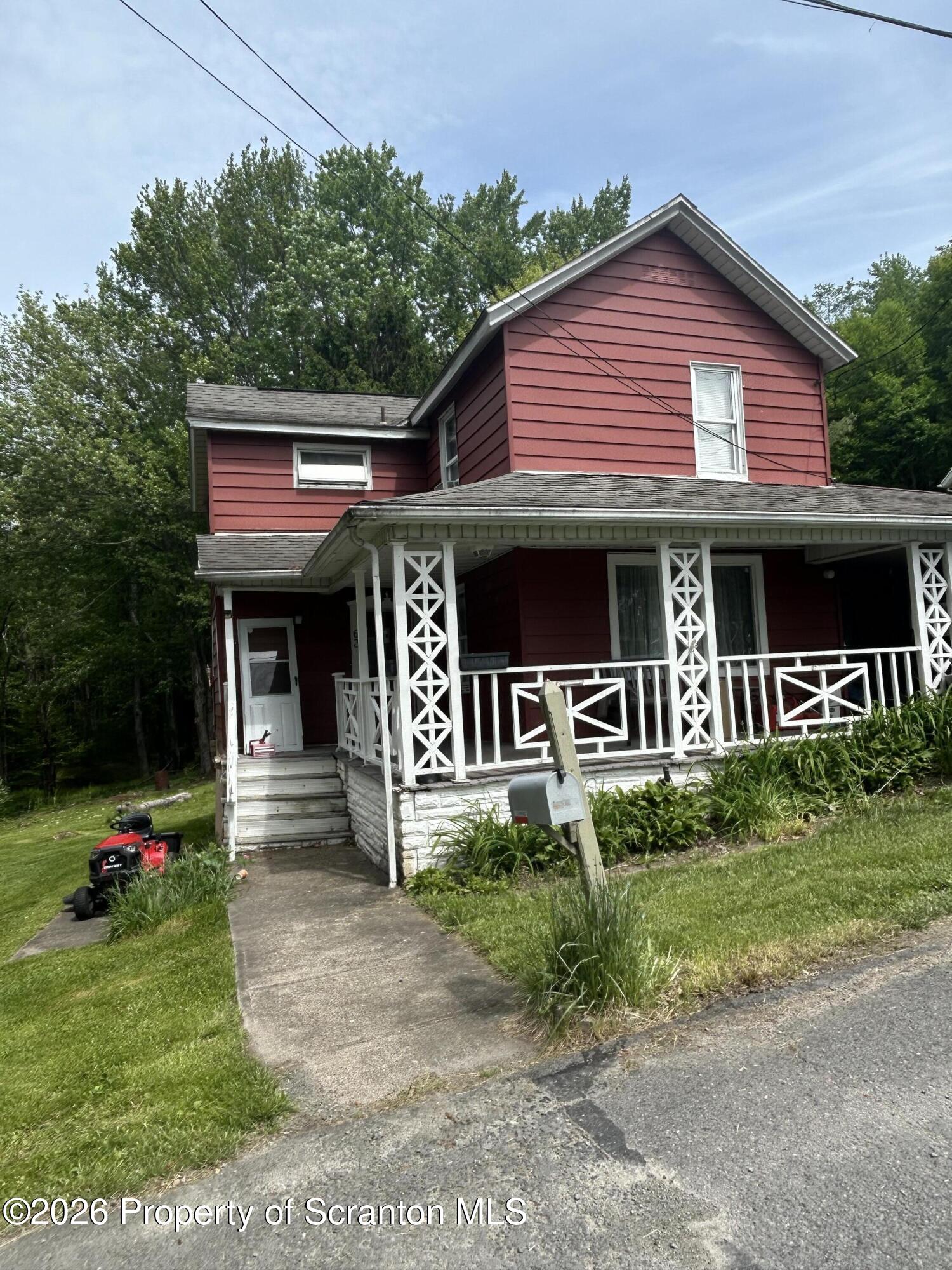 63 Shannon Street Simpson, PA 18407 - Photo 1 of 18 a front view of a house with a yard