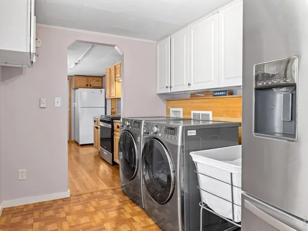 a view of a kitchen with washer and dryer