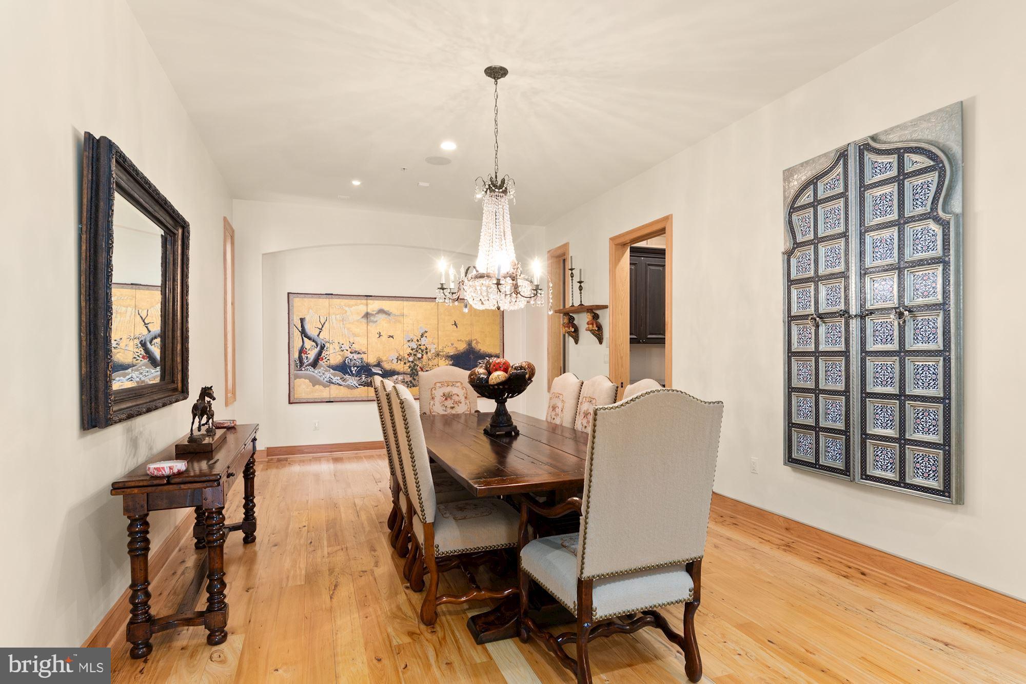 7400 Nevis Road Bethesda, MD 20817 - Photo 11 of 47 a view of a dining room with furniture window and wooden floor