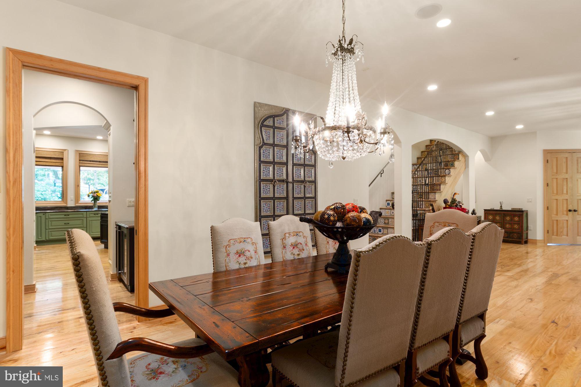 7400 Nevis Road Bethesda, MD 20817 - Photo 12 of 47 a view of a dining room with furniture and chandelier