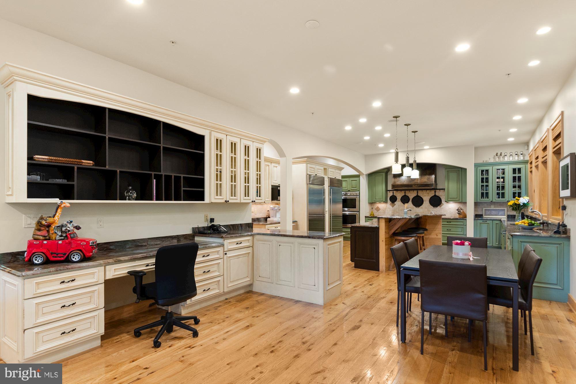 7400 Nevis Road Bethesda, MD 20817 - Photo 16 of 47 a kitchen with a sink cabinets and window
