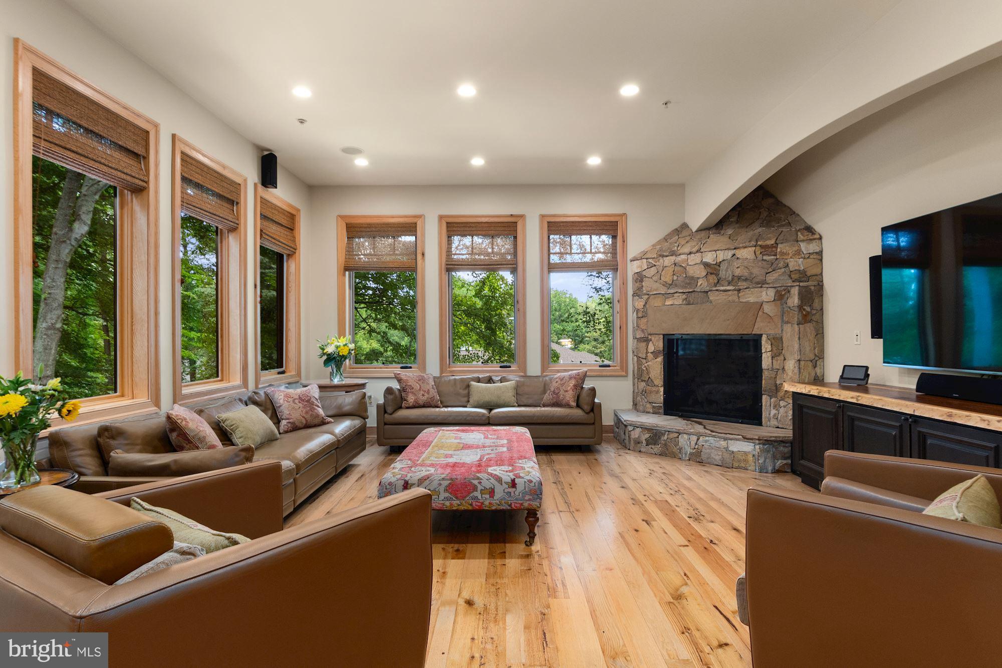 7400 Nevis Road Bethesda, MD 20817 - Photo 19 of 47 a living room with furniture and a fireplace
