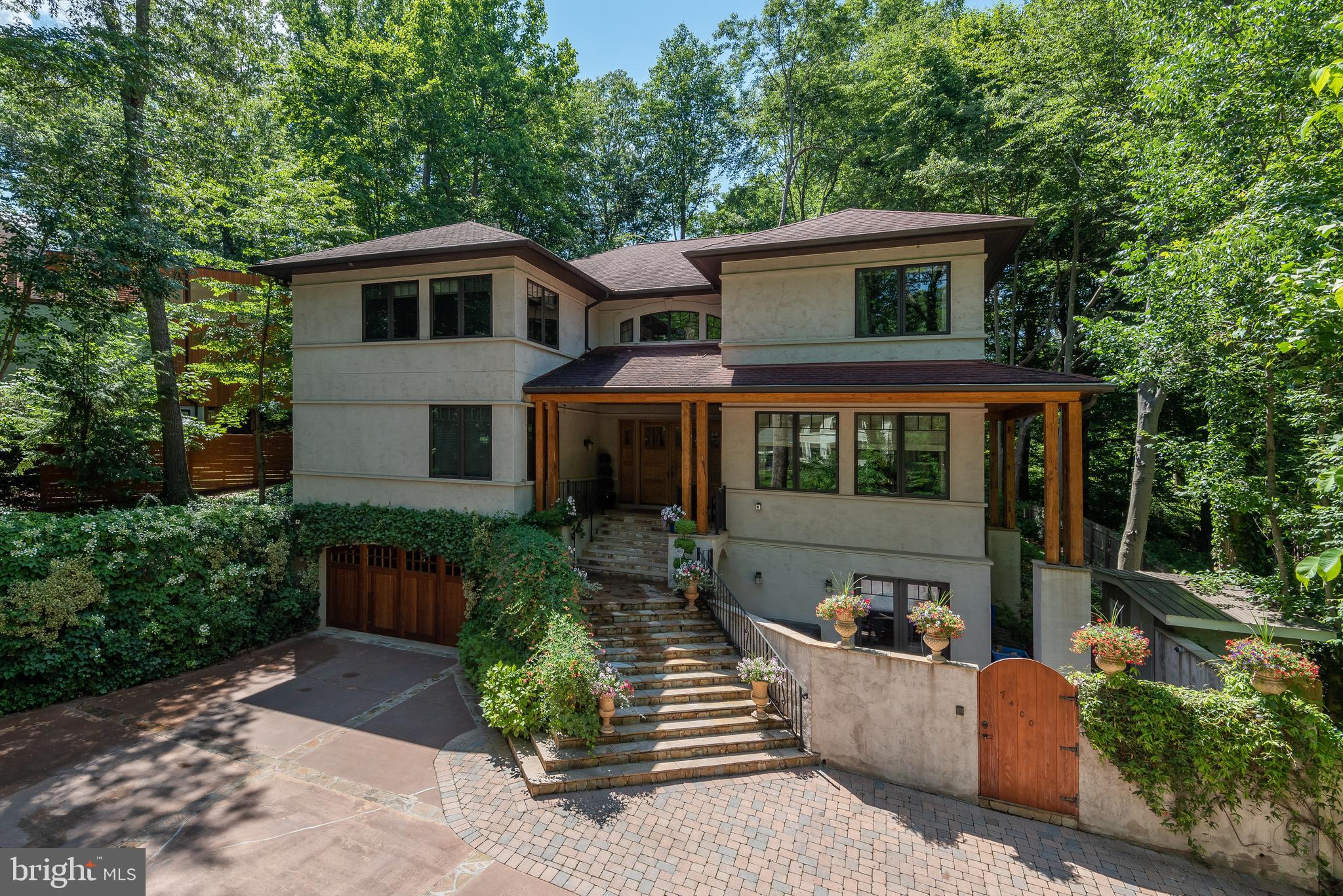 7400 Nevis Road Bethesda, MD 20817 - Photo 2 of 47 a front view of a house with garden