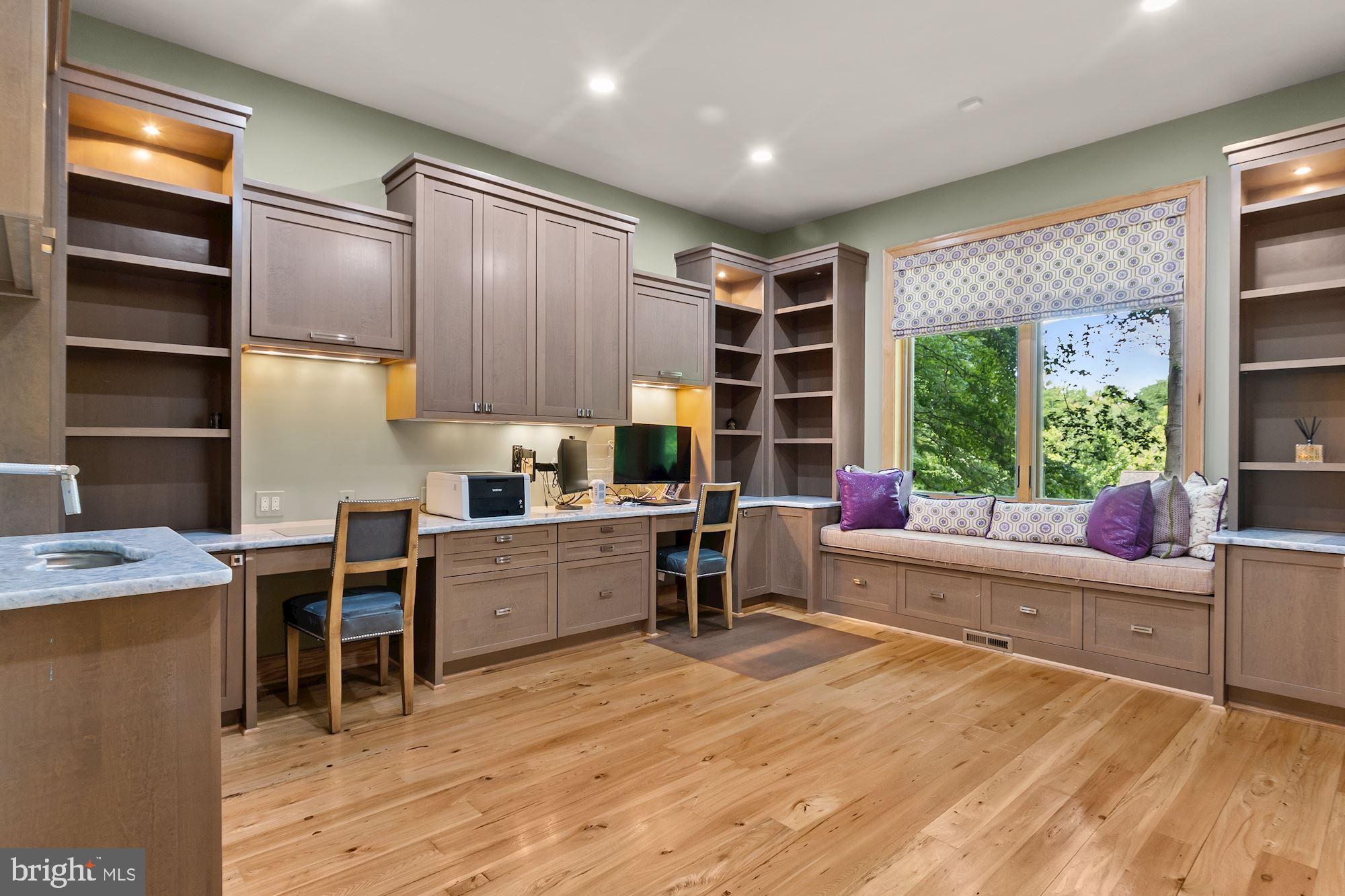 7400 Nevis Road Bethesda, MD 20817 - Photo 21 of 47 a kitchen with a stove a refrigerator and wooden cabinets