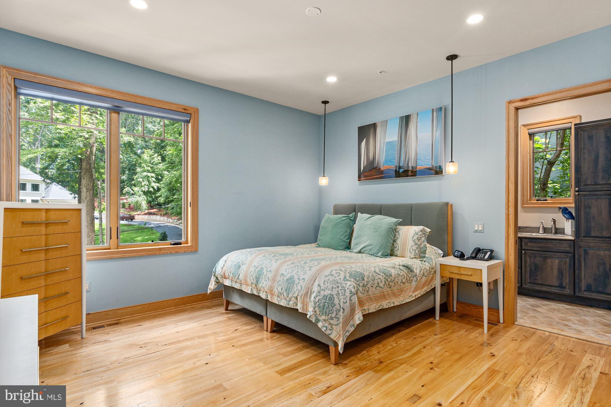 7400 Nevis Road Bethesda, MD 20817 - Photo 23 of 47 a bedroom with a bed wooden floor and window