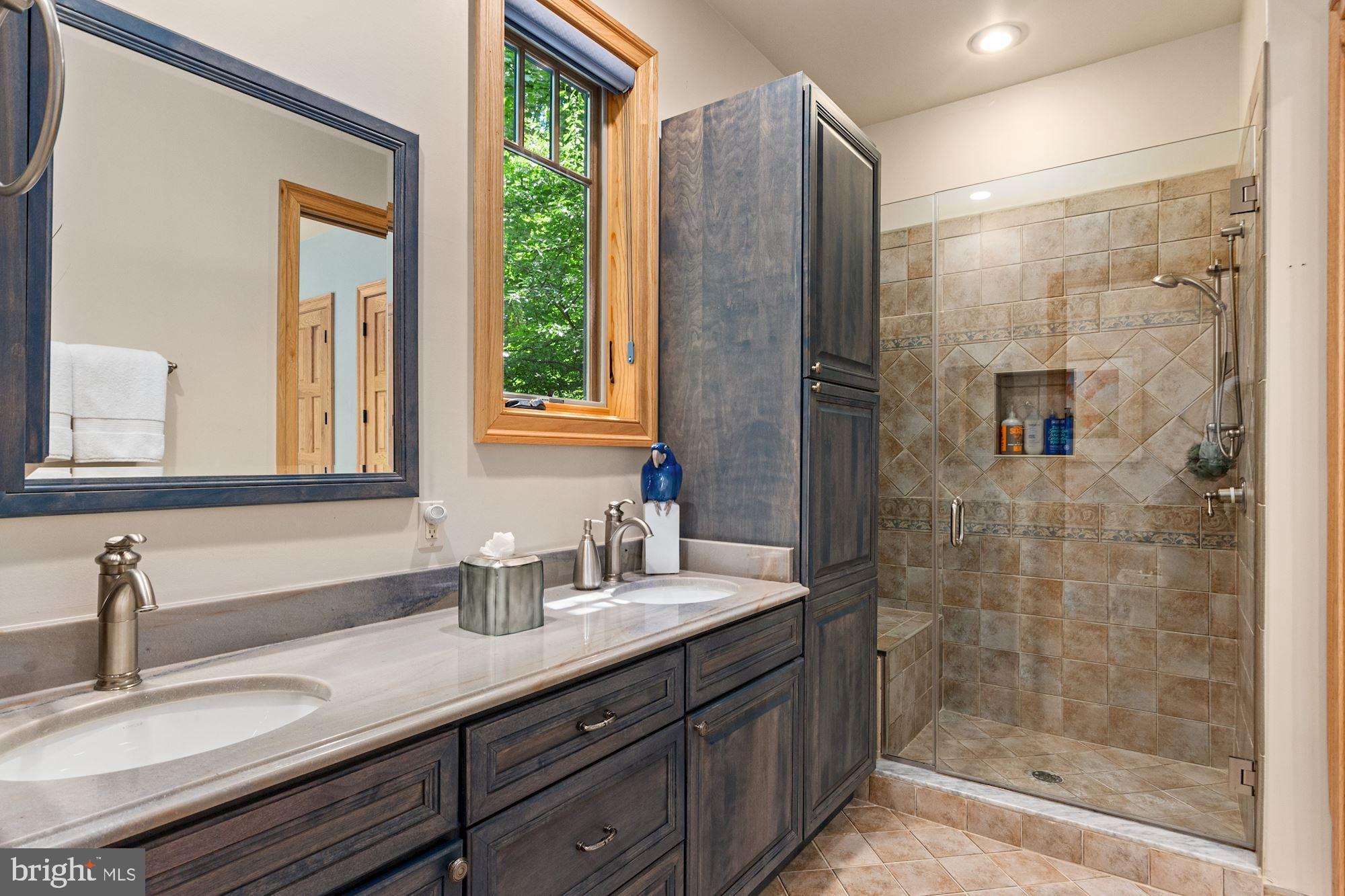 7400 Nevis Road Bethesda, MD 20817 - Photo 24 of 47 a bathroom with a granite countertop sink mirror and double