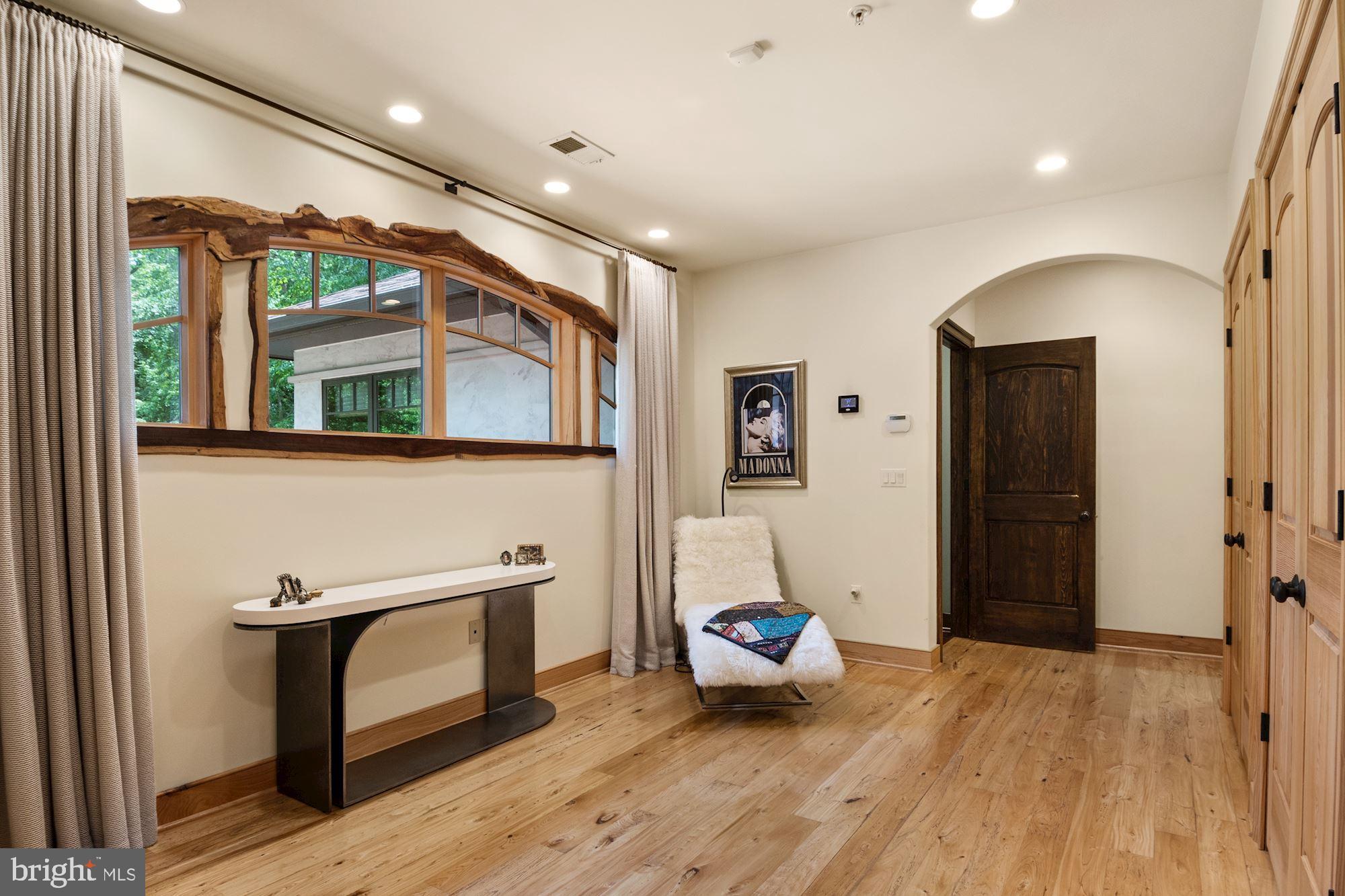 7400 Nevis Road Bethesda, MD 20817 - Photo 28 of 47 a living room with furniture and a wooden floor