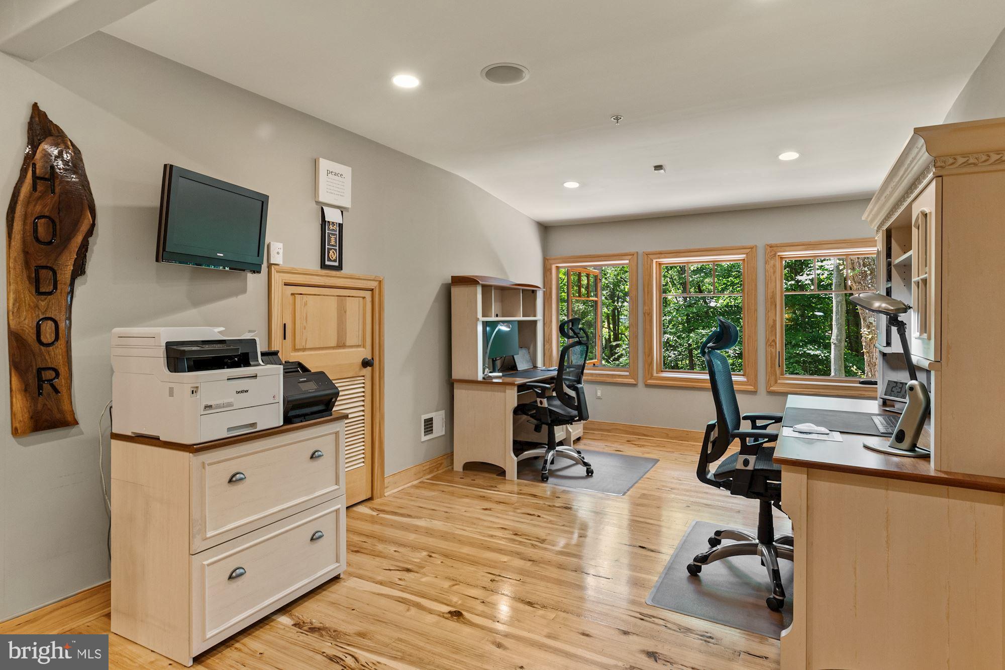 7400 Nevis Road Bethesda, MD 20817 - Photo 37 of 47 a view of a livingroom with workspace and a window