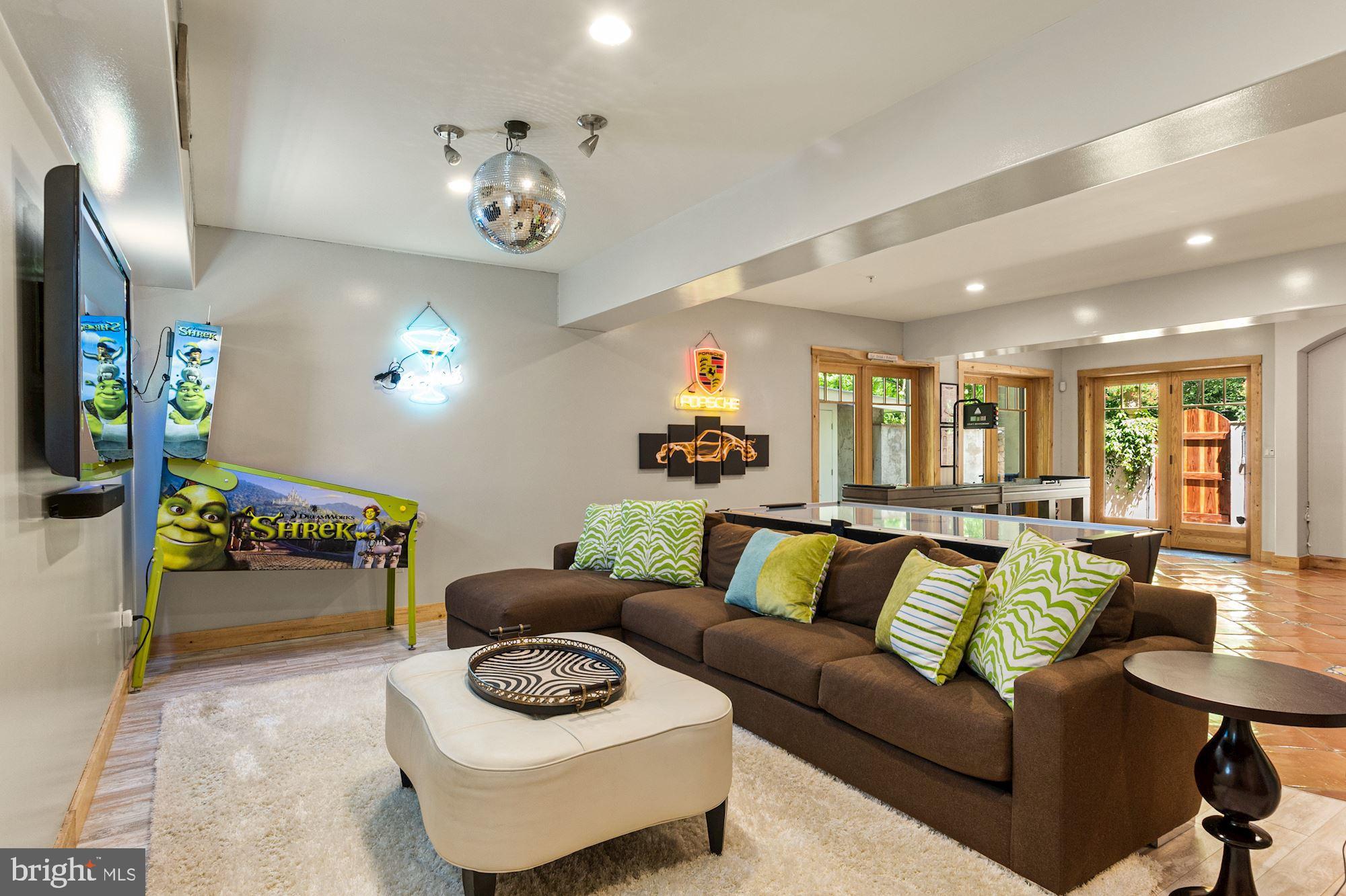 7400 Nevis Road Bethesda, MD 20817 - Photo 38 of 47 a living room with furniture and a chandelier
