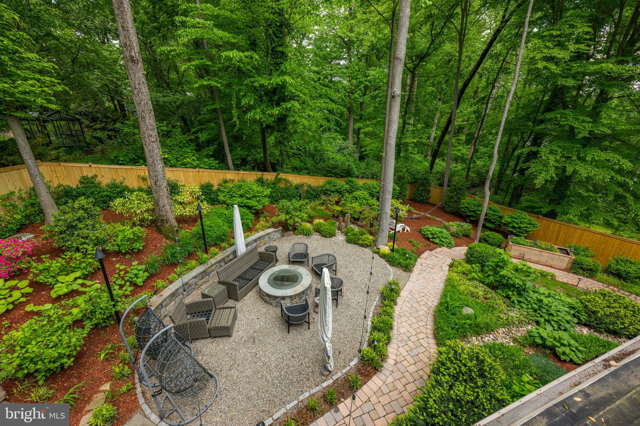 7400 Nevis Road Bethesda, MD 20817 - Photo 4 of 47 a view of a backyard with sitting area