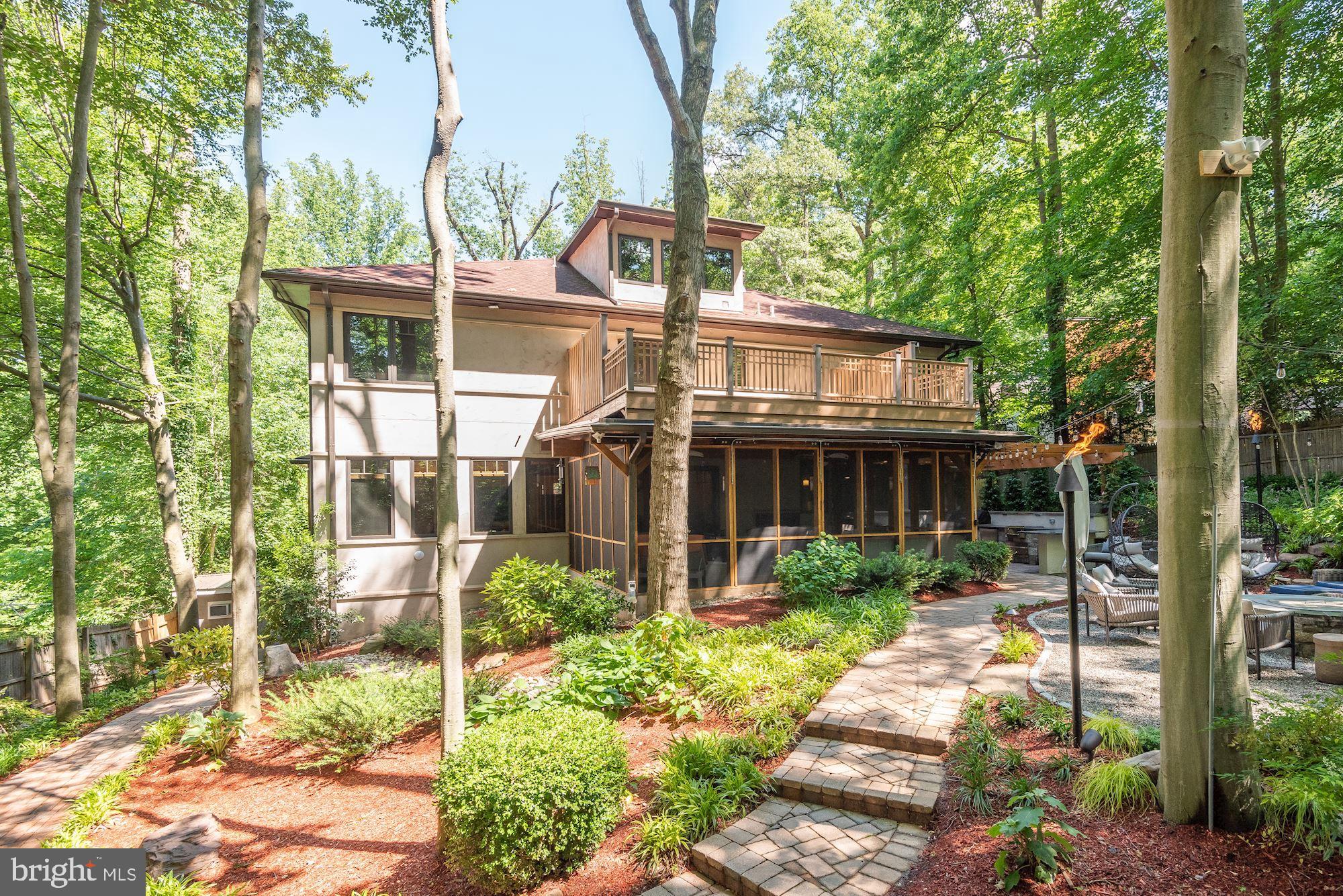 7400 Nevis Road Bethesda, MD 20817 - Photo 46 of 47 a view of a brick house with a yard and large trees