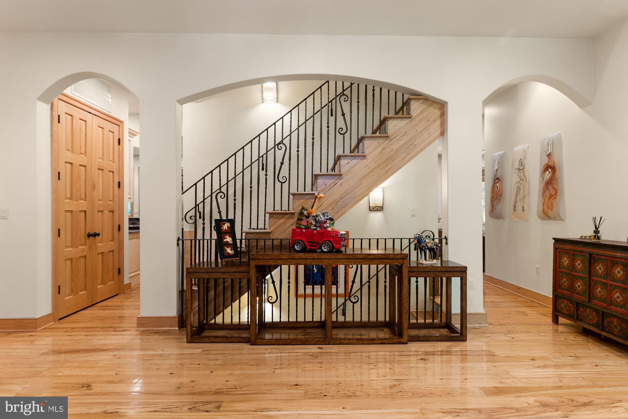 7400 Nevis Road Bethesda, MD 20817 - Photo 7 of 47 a view of entryway and hall with wooden floor