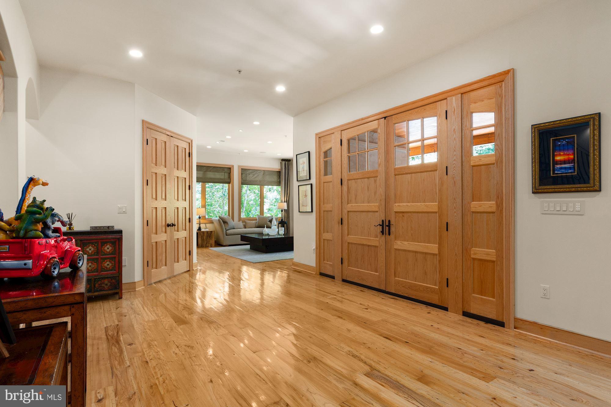 7400 Nevis Road Bethesda, MD 20817 - Photo 8 of 47 a view of a livingroom with furniture window and wooden floor