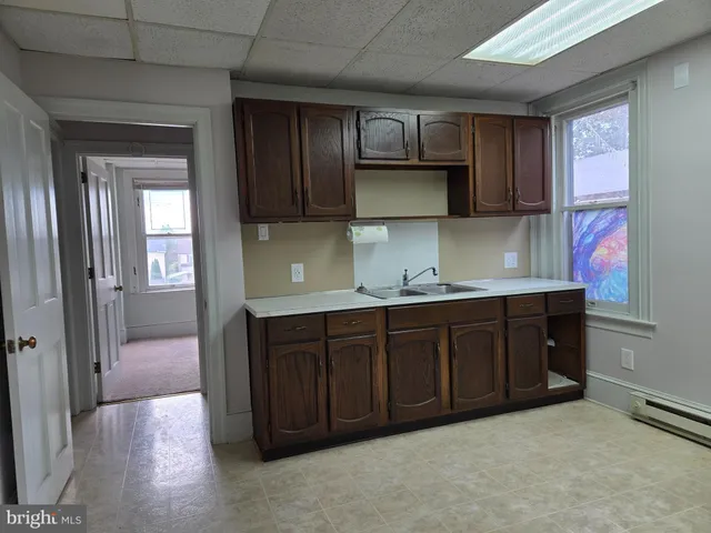 a kitchen with stainless steel appliances granite countertop wooden cabinets a sink and dishwasher