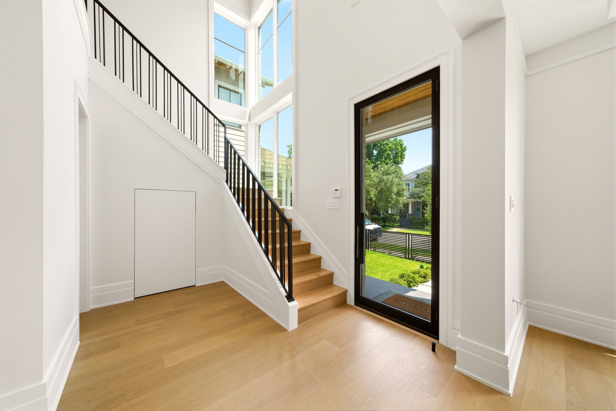 1023 Euclid Street Houston, TX 77009 - Photo 22 of 50 Impressive staircase leads you upstairs with bold iron detailing. Dramatic windows overlooking the front yard.