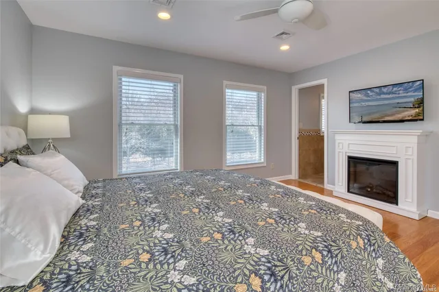 a bedroom with a bed and a fireplace