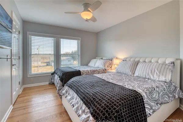 a bedroom with double bed and a window
