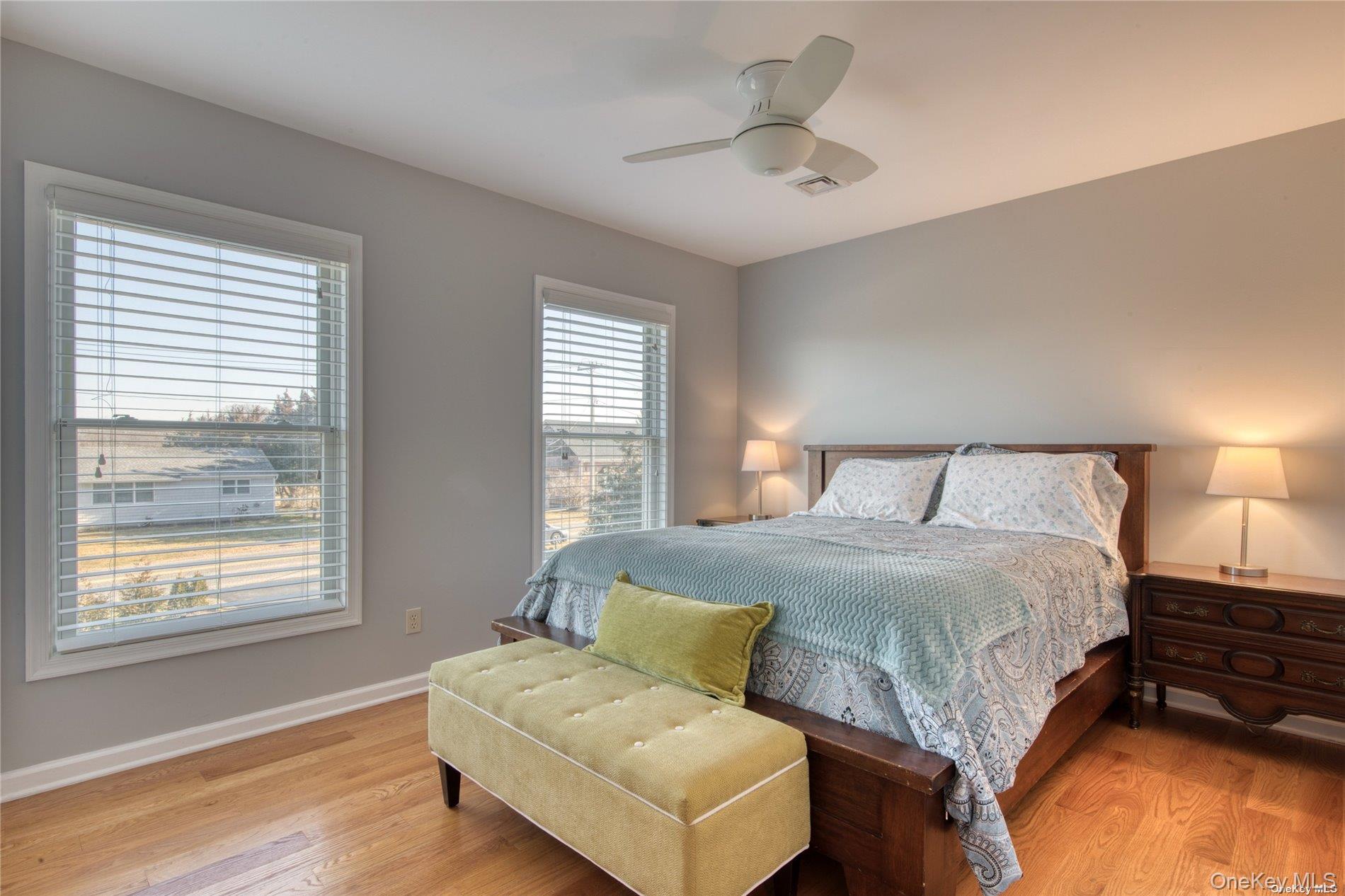 750 Kerwin Boulevard Greenport, NY 11944 - Photo 14 of 21 a bedroom with a bed and window