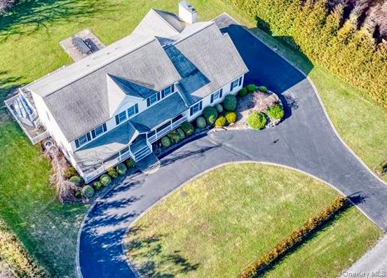750 Kerwin Boulevard Greenport, NY 11944 - Photo 2 of 21 a view of swimming pool with a garden and plants