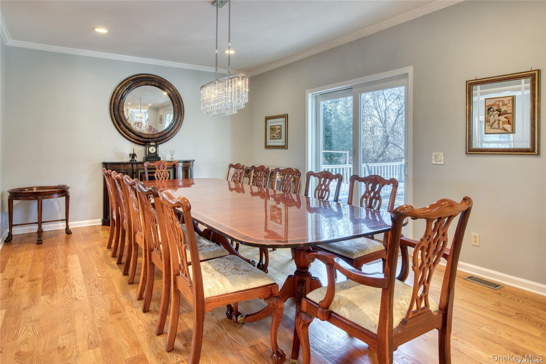 750 Kerwin Boulevard Greenport, NY 11944 - Photo 4 of 21 a view of a dining room with furniture and chandelier