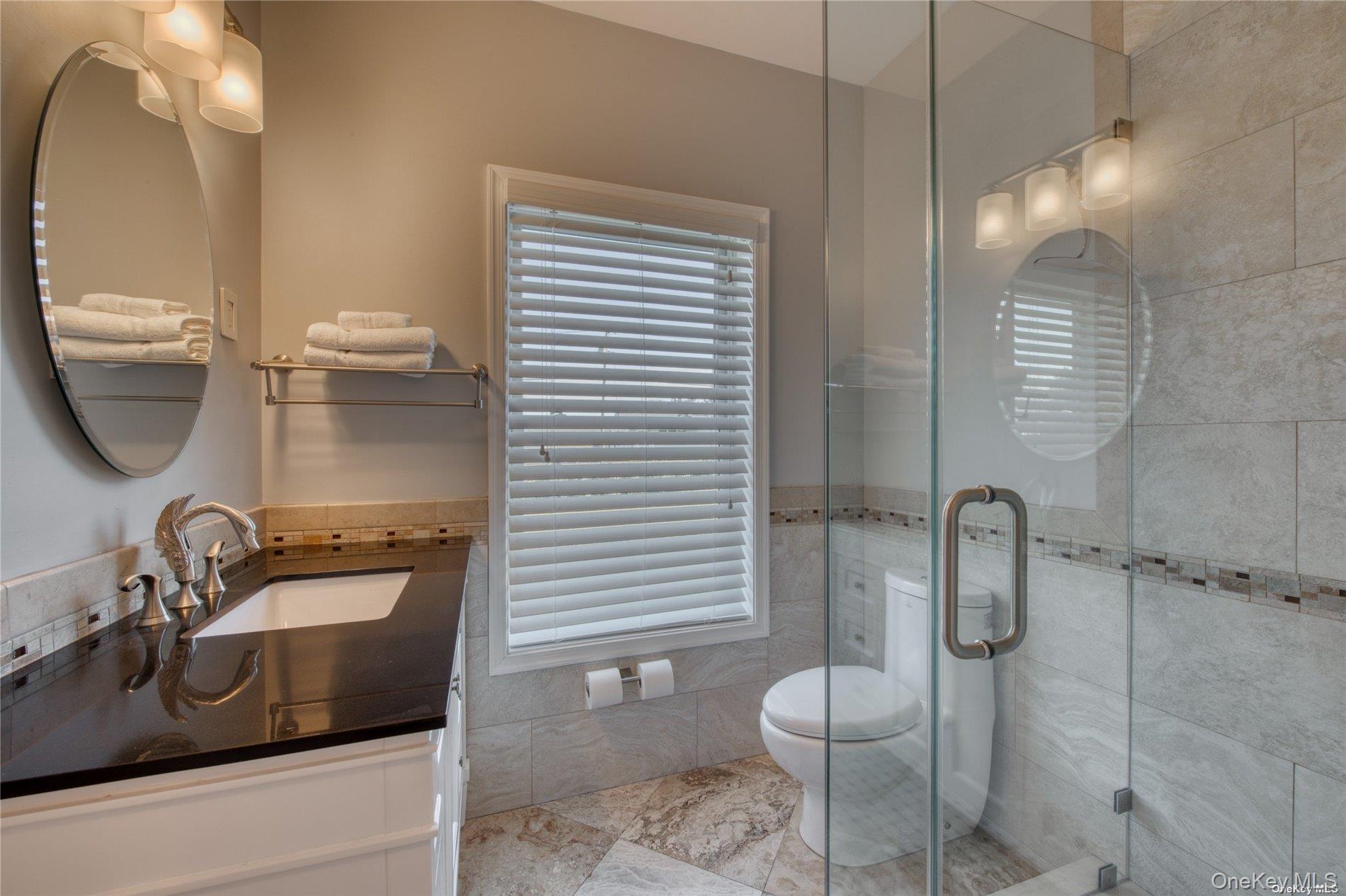 750 Kerwin Boulevard Greenport, NY 11944 - Photo 8 of 21 a bathroom with a sink toilet and shower