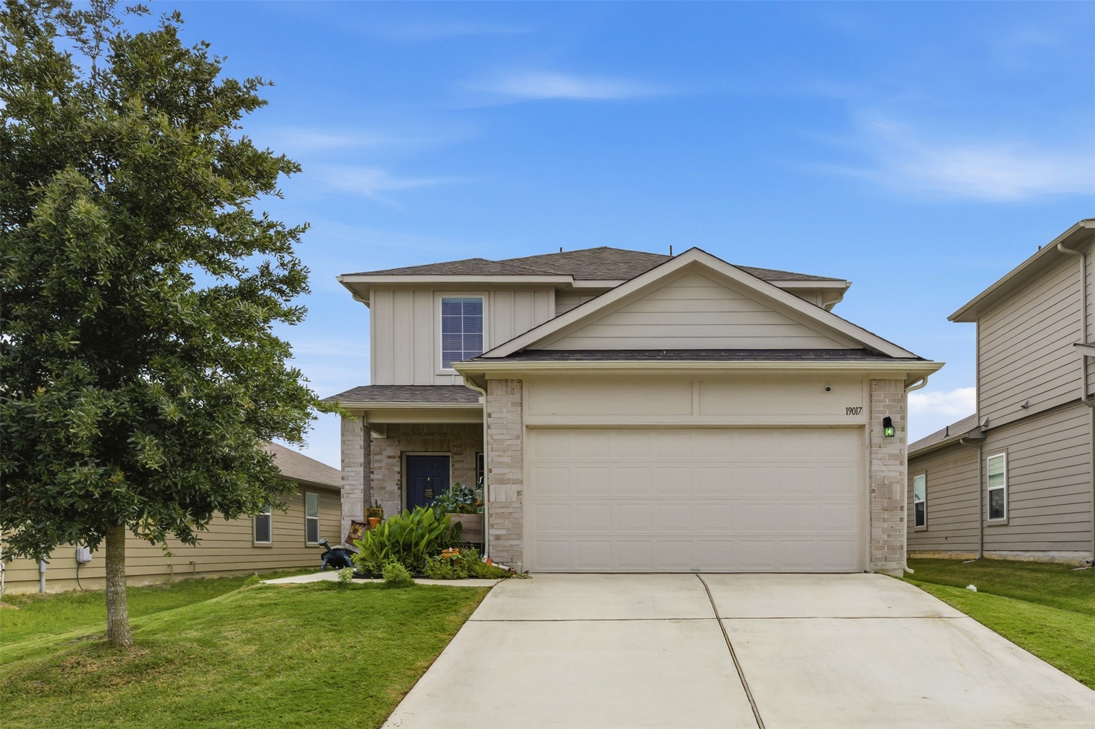 19017 Romano Drive Elgin, TX 78621 - Photo 2 of 33 Two-story residence featuring a combination of stone and horizontal siding