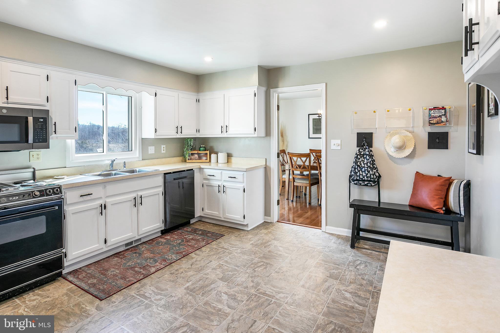 11946 Ropp Lane Lovettsville, VA 20180 - Photo 11 of 48 a kitchen with stainless steel appliances kitchen island granite countertop a sink and cabinets