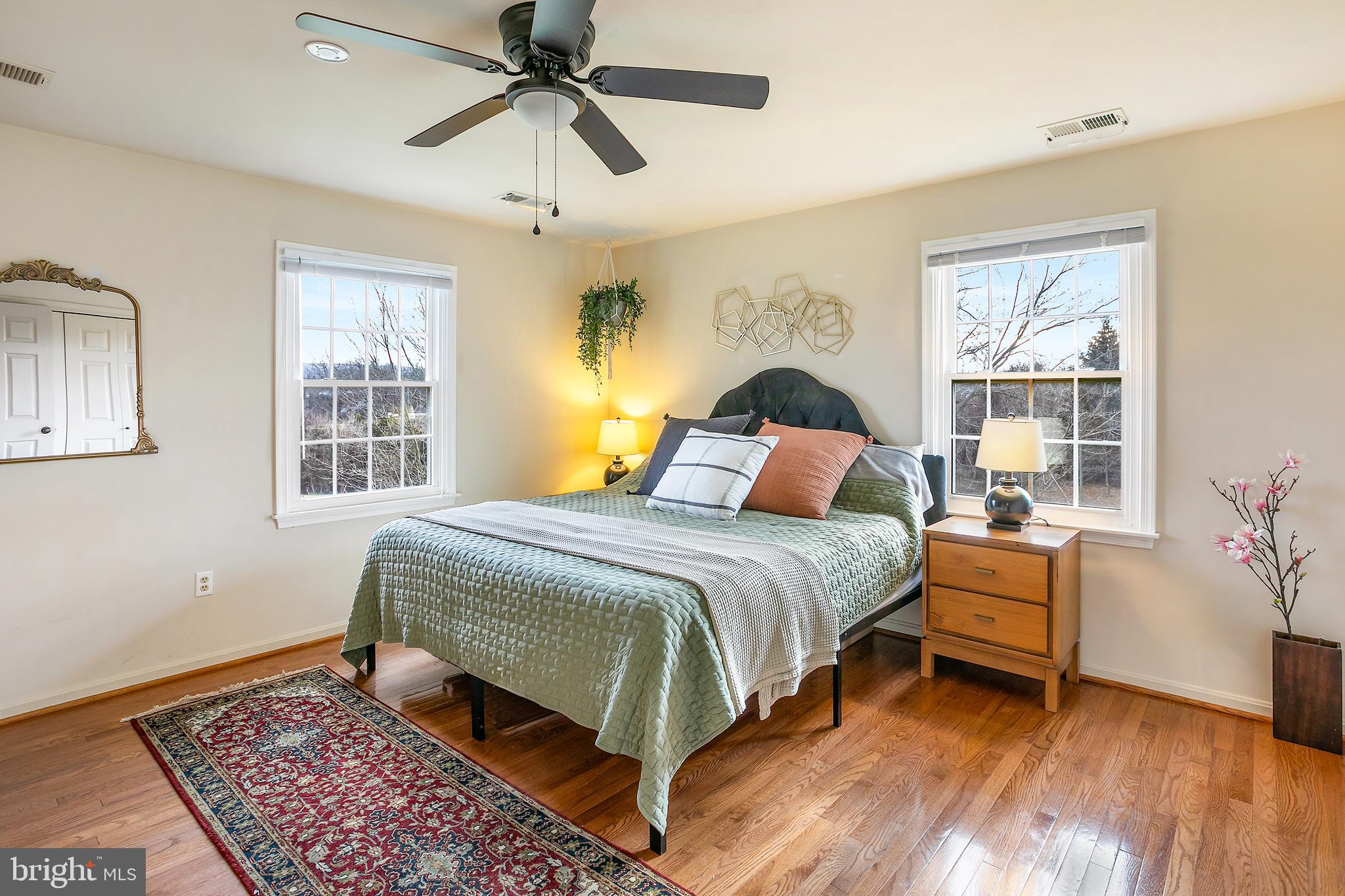11946 Ropp Lane Lovettsville, VA 20180 - Photo 13 of 48 a bedroom with a bed and wooden floor
