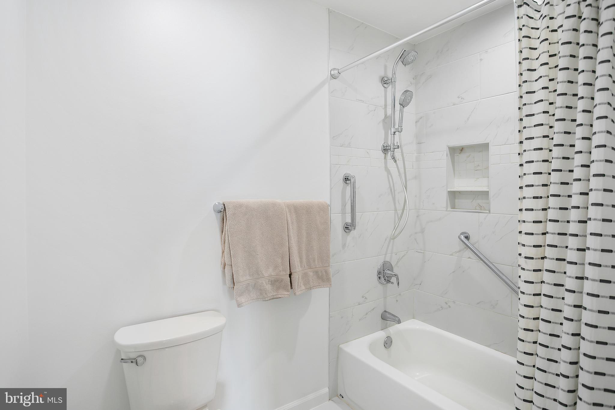 11946 Ropp Lane Lovettsville, VA 20180 - Photo 17 of 48 a white bath tub sitting next to a white toilet