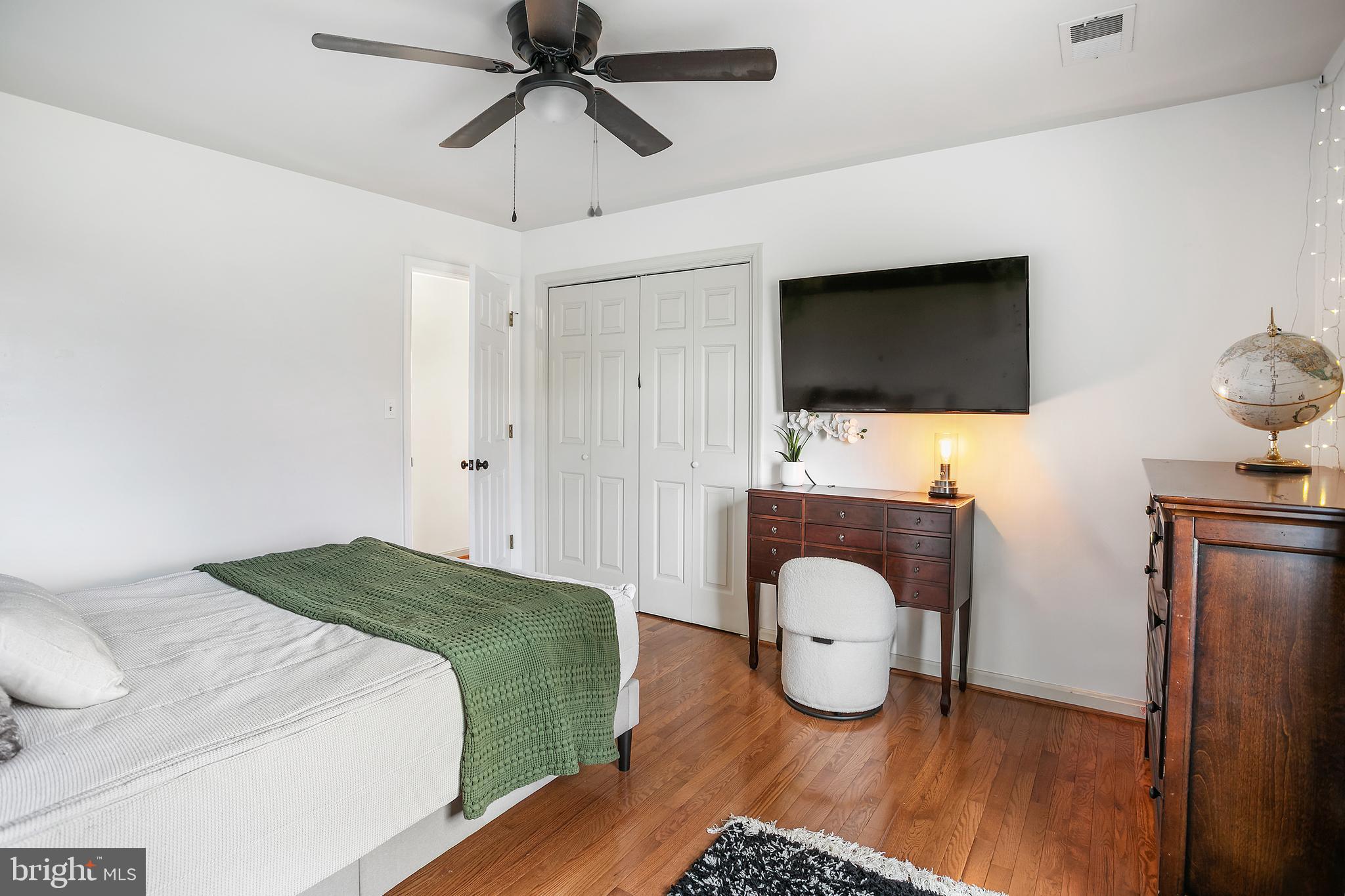 11946 Ropp Lane Lovettsville, VA 20180 - Photo 19 of 48 a bedroom with a bed and flat screen tv