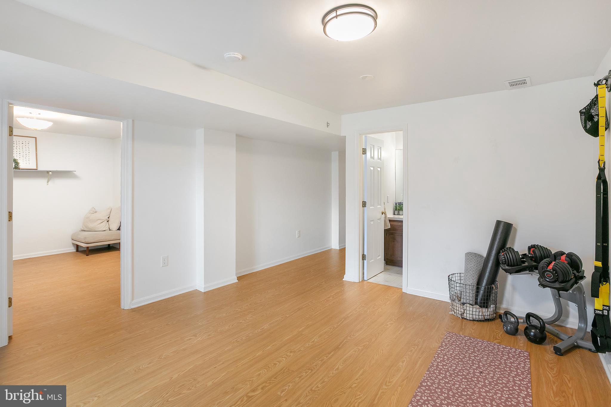 11946 Ropp Lane Lovettsville, VA 20180 - Photo 24 of 48 a view of a room that has a bed and gym equipment