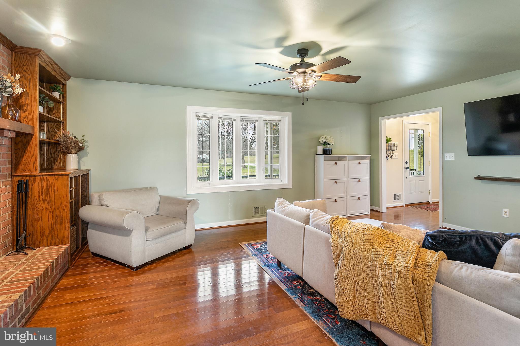 11946 Ropp Lane Lovettsville, VA 20180 - Photo 5 of 48 a living room with furniture and a flat screen tv