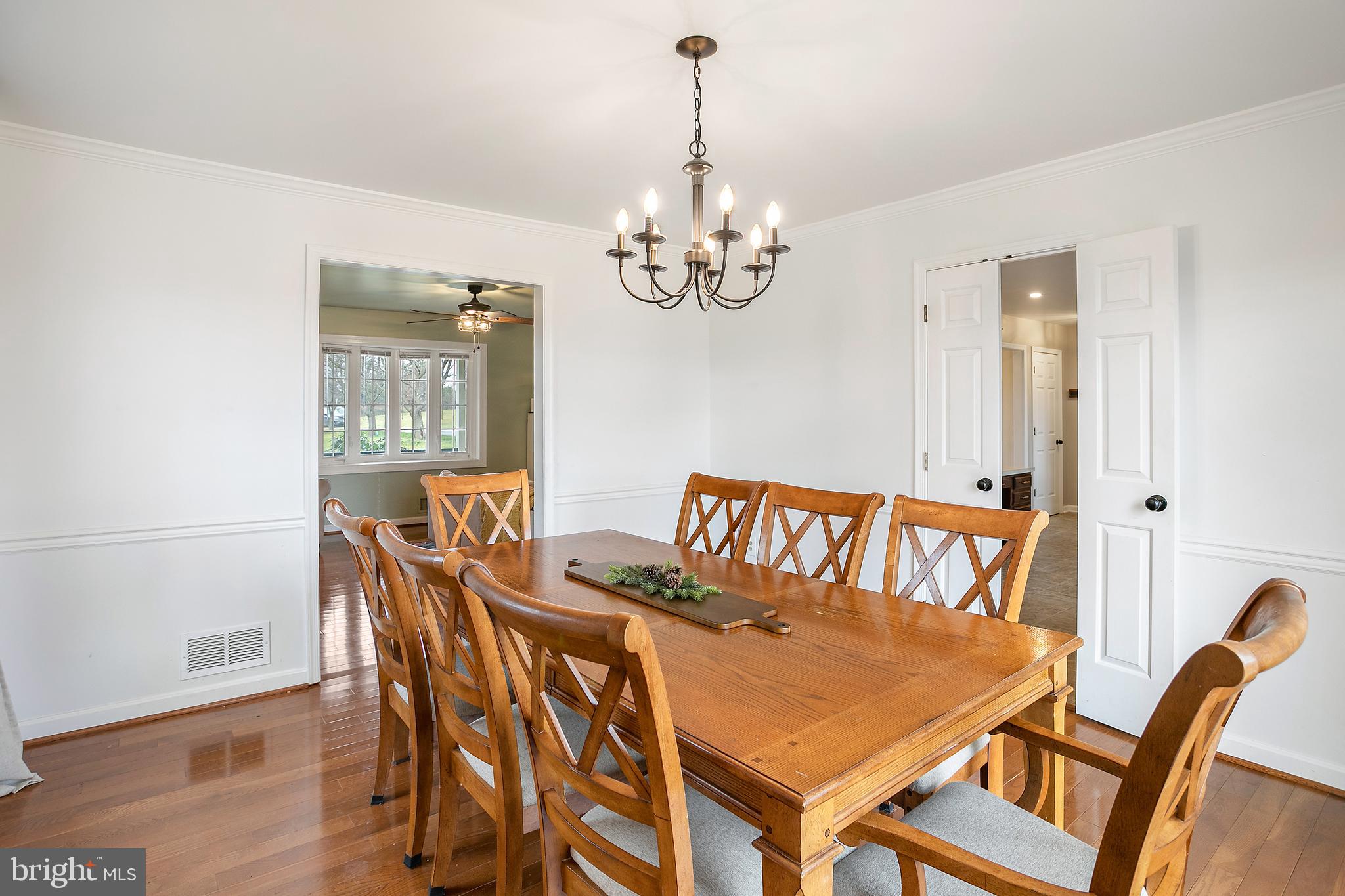 11946 Ropp Lane Lovettsville, VA 20180 - Photo 7 of 48 a view of a dining room with furniture wooden floor and chandelier