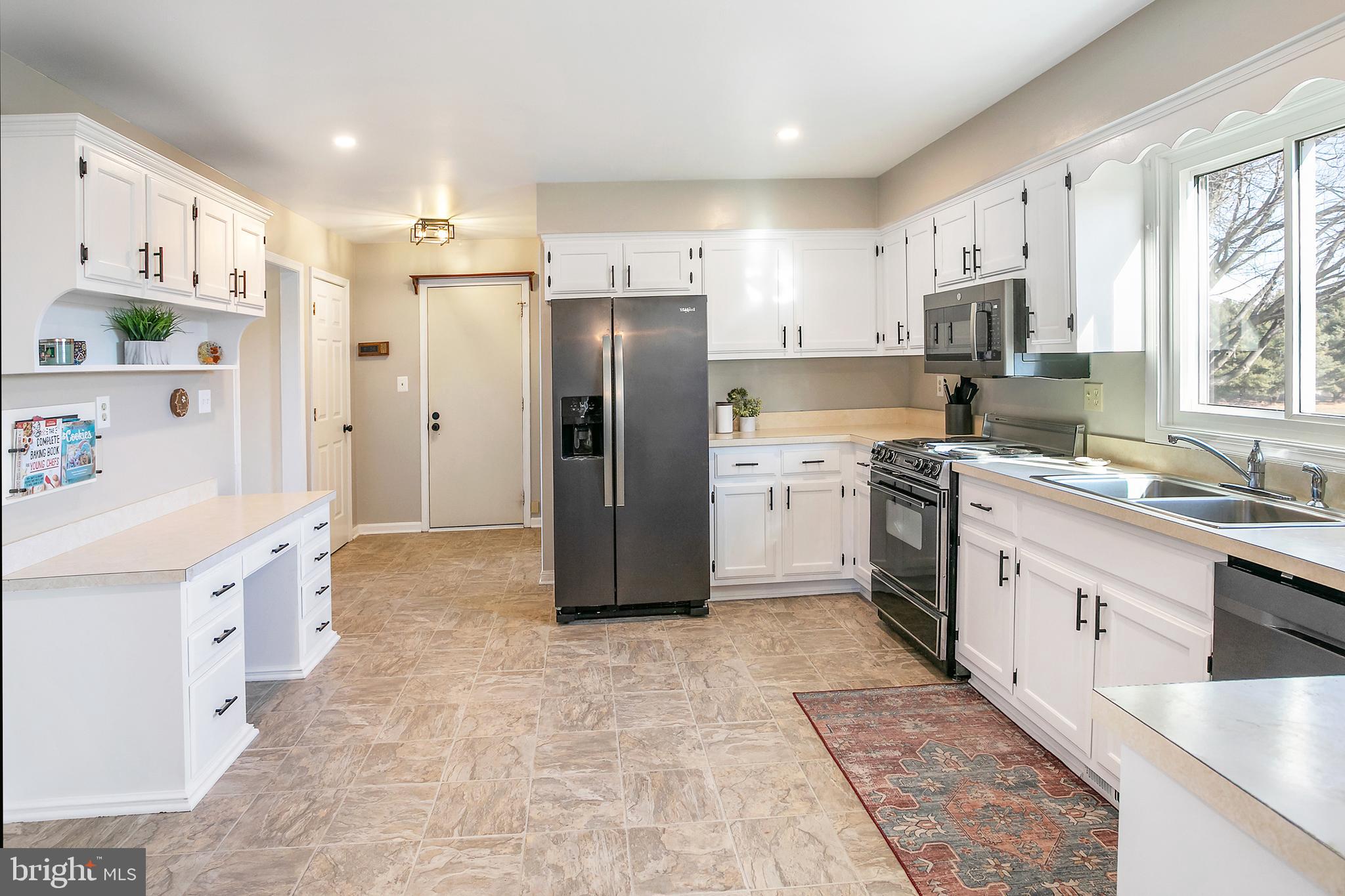 11946 Ropp Lane Lovettsville, VA 20180 - Photo 8 of 48 a large kitchen with stainless steel appliances cabinets a sink and a counter top space