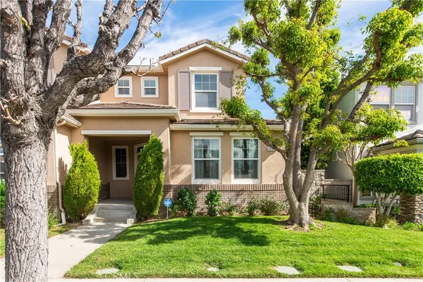 front view of a house with a yard