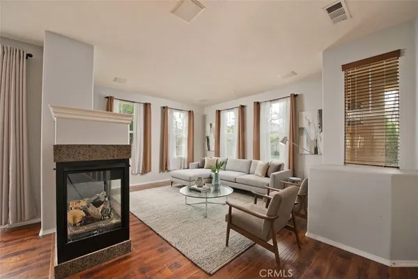 a view of a kitchen with a sink cabinets and a fireplace