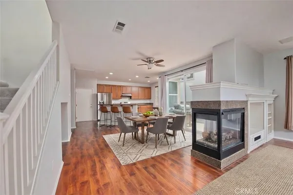 a kitchen with stainless steel appliances granite countertop sink stove top oven and refrigerator