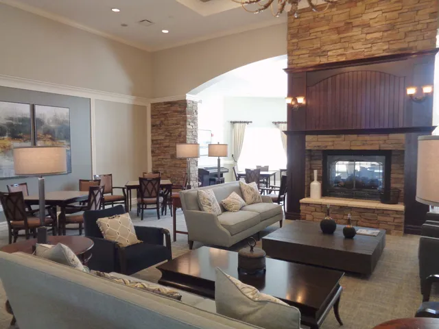a living room with fireplace furniture and a fireplace