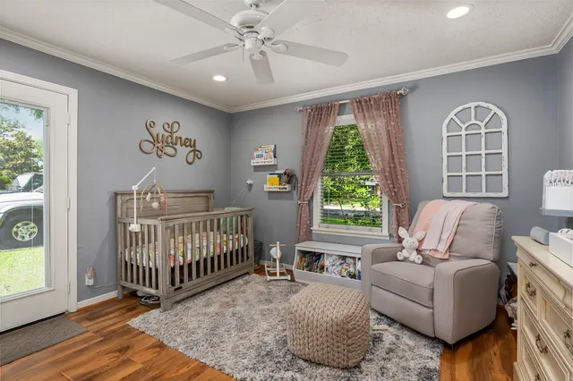 a living room with furniture and windows